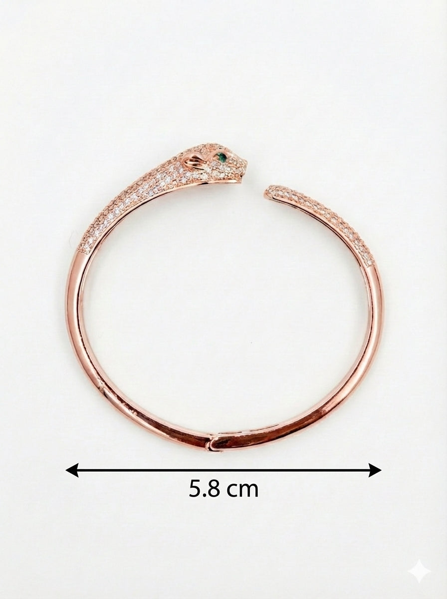 Rose gold bracelet with panther design and measurement on a white background