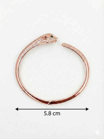 Rose gold bracelet with panther design and measurement on a white background