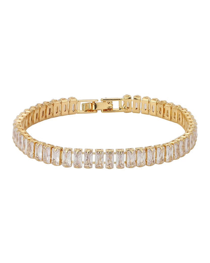 Gold bracelet with clear gemstones on a white background
