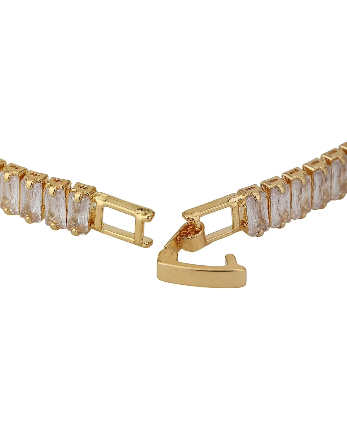 Gold bracelet with clear gemstones on a white background