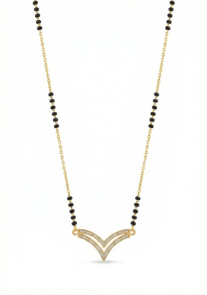 Necklace with gold pendant and black beads on a white background