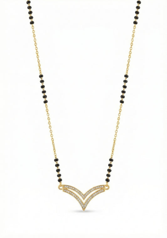 Necklace with gold pendant and black beads on a white background