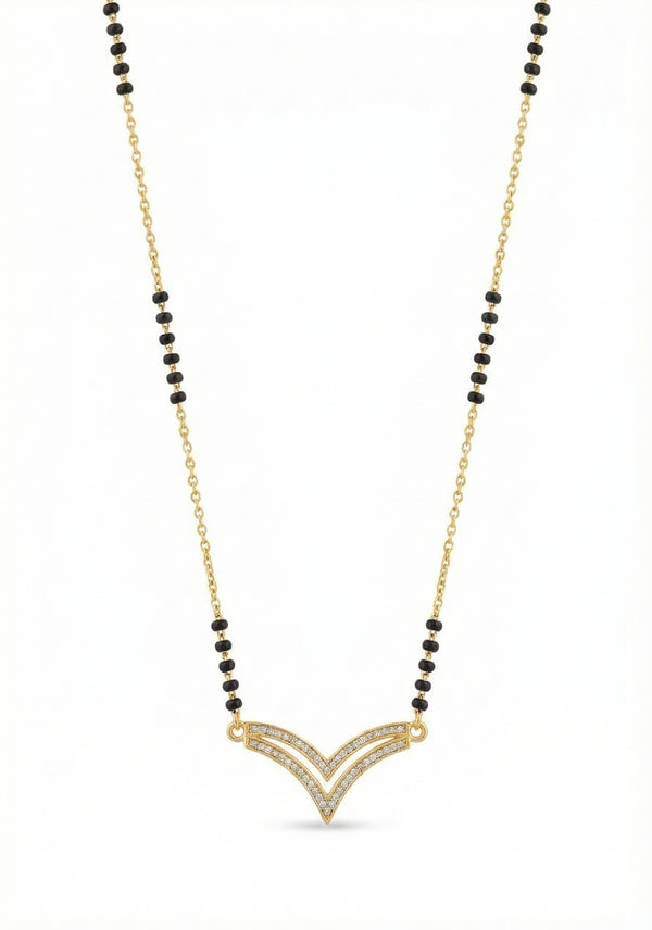 Necklace with gold pendant and black beads on a white background