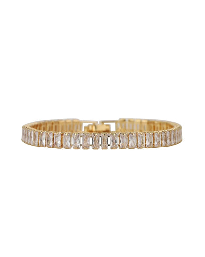Gold bracelet with clear gemstones on a white background