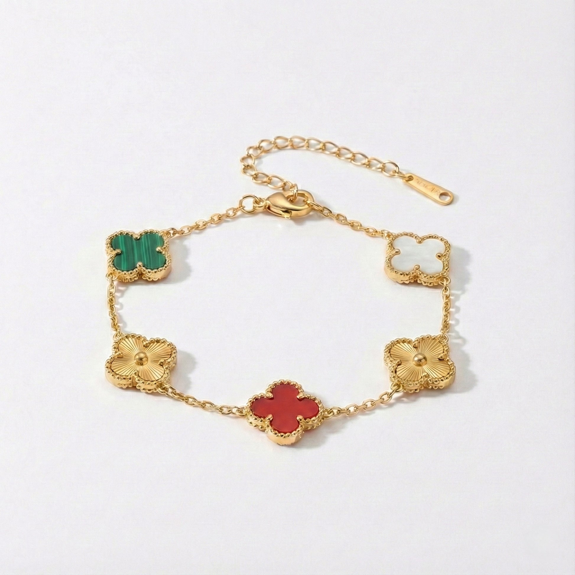Gold bracelet with colorful clover-shaped charms on a white background