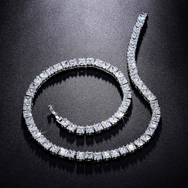 Square-cut diamond look tennis bracelet on a woman’s wrist in natural light